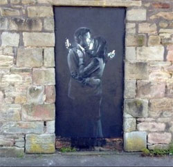 Banksy’s “Mobile Lovers” on the wall of the Broad Plain youth club in Bristol in 2014
